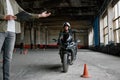 Student learning how to drive motorcycle with one hand Royalty Free Stock Photo