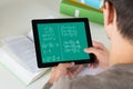 Student Learning Mathematical Equations On Digital Tablet