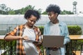 Student Life. Two students in school and working on laptop, checking social media. Teen student in university Use laptop and Table Royalty Free Stock Photo