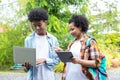 Student Life. Two students in school and working on laptop, checking social media. Teen student in university Use laptop and Table Royalty Free Stock Photo