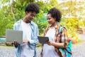 Student Life. Two students in school and working on laptop, checking social media. Teen student in university Use laptop and Table Royalty Free Stock Photo