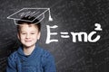 Student little boy and science background. Kid is thinking about science formula Royalty Free Stock Photo