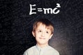 Student little boy and science background. Kid is thinking about science formula Royalty Free Stock Photo