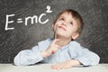 Student little boy and science background. Kid is thinking about Formula Royalty Free Stock Photo