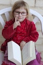 Student little girl reading bood Royalty Free Stock Photo