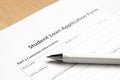 Student loan application form wth pen on desk Royalty Free Stock Photo