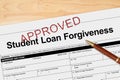 Student Loan Forgiveness application approved with pen Royalty Free Stock Photo