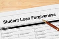 Student Loan Forgiveness application with pen Royalty Free Stock Photo