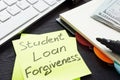 Student loan forgiveness written on a memo stick.