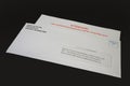 Student Loan Payments Resuming Notice in Envelope on Black Desk, right angled. Royalty Free Stock Photo