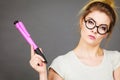 Woman holding big oversized pencil thinking about something Royalty Free Stock Photo