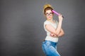 Woman holding big oversized pencil thinking about something Royalty Free Stock Photo