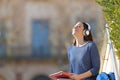 Student meditating listening to music in a campus Royalty Free Stock Photo