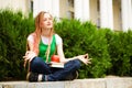 Student meditating outdoors Royalty Free Stock Photo