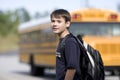 Student near the school bus Royalty Free Stock Photo