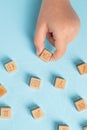 Student organizing wooden cubes with education icons. Education concept Royalty Free Stock Photo