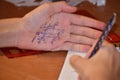 Cheat sheet on the hand. Formula written in the palm of a schoolboy. Hint in the palm of your hand Royalty Free Stock Photo