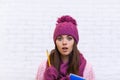 Student Pondering Worried Attractive Girl In Pink Hat Holding Folder Pencil Royalty Free Stock Photo