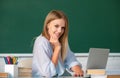 Student preparing exam and learning lessons in school classroom. Beautiful caucasian female student is studying in Royalty Free Stock Photo