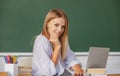 Student preparing exam and learning lessons in school classroom. Beautiful caucasian female student is studying in Royalty Free Stock Photo