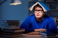 The student preparing for exams late at night in library Royalty Free Stock Photo
