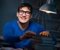 Student preparing for exams late at night in library Royalty Free Stock Photo