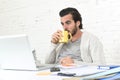 Student preparing university project or hipster style freelancer businessman working with laptop Royalty Free Stock Photo