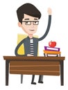 Student raising hand in class for an answer. Royalty Free Stock Photo