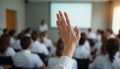 Student Raising Hand During Classroom Lecture or Seminar Royalty Free Stock Photo