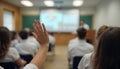 Student Raising Hand During Classroom Lecture or Seminar Royalty Free Stock Photo