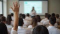 Student Raising Hand During Classroom Lecture or Seminar Royalty Free Stock Photo