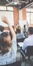 Student raising hand during lecture or seminar Royalty Free Stock Photo