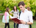 Student reading a book at the park Royalty Free Stock Photo