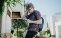 Student reading notes in school courtyard during sunny day Royalty Free Stock Photo