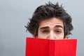 Student reading a suspense novel Royalty Free Stock Photo