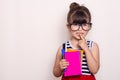 Student ready for school. Children`s Stationery for school. Kid with notebook and pen in hands. Royalty Free Stock Photo