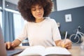 Student research, writing notes and black woman remote eduction on a home computer. Working, planning and reading