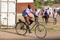 Student riding bicycle in Africa