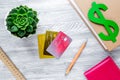 Student`s desk with dollar sign for fee-paying education set gray background top view Royalty Free Stock Photo