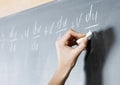 Student's hand solving maths problem Royalty Free Stock Photo