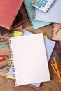 Student school desk with blank books, pen, pencil, copy space, vertical Royalty Free Stock Photo