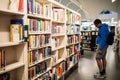 Student searcing for books in City of Tampere Main Library Metso