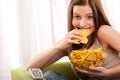 Student series - Young woman eating potato chips Royalty Free Stock Photo