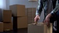 Student settling in hostel, unpacking his things, beginning of independent life Royalty Free Stock Photo