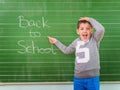 Student shows a board with the inscription: Back to School