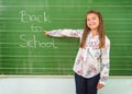 Student shows a board with the inscription: Back to School