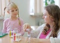 student shows experiment for the girl