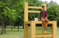 Teenage Boy Sitting on a Big Chair