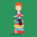 Student sitting on huge pile of books. Royalty Free Stock Photo