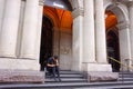 Student sitting on steps of Melbourne GPO